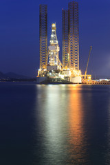 Fototapeta na wymiar Jack up oil drilling rig in the shipyard for maintenance