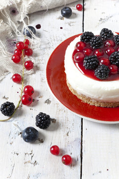 mini cheesecake with blackberries blueberries and red currant