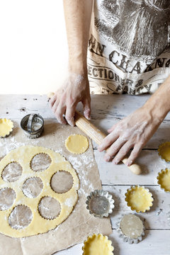 man hands making shortcrust pastry for little tart