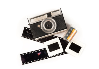 old camera and blank film strip on White background