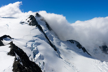 Fototapeta na wymiar Snowy mountain peak