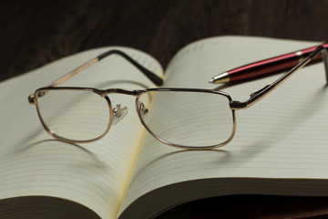 Notepad and glasses