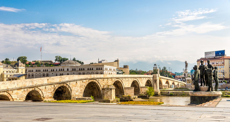 Stone bridge across the Vardar River in Skopje - obrazy, fototapety, plakaty