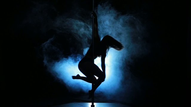 2of23 Silhouette of a sexy female pole dancing