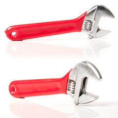 Red and Silver Metal Monkey Wrench Isolated On White Background.