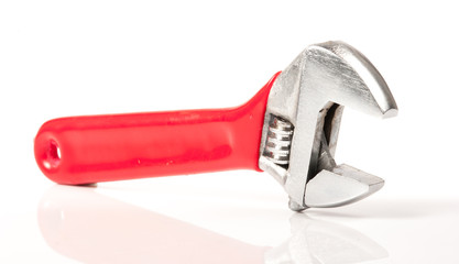 Red and Silver Metal Monkey Wrench Isolated On White Background.