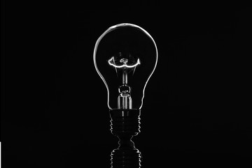 Light bulb on black background