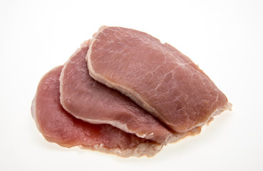 sliced raw pork on white background