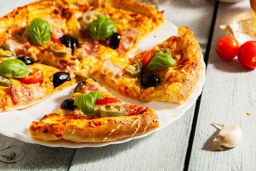 Pizza with bacon, olives and jalapeno pepper