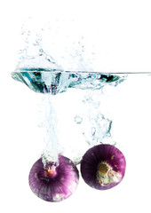 Red sliced onion isolated on white background