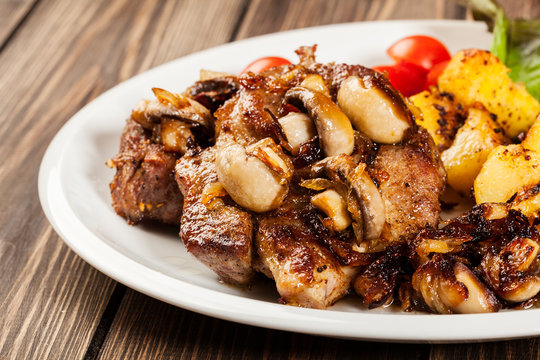 Fried pork chop with mushrooms and chips