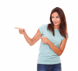 Sexy hispanic lady pointing to her right