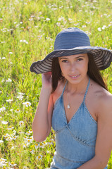 Beautiful woman on the flowers field