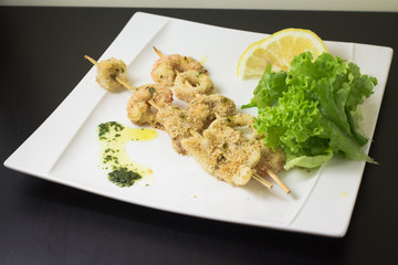 fish spit with salad lemon and parsley sauce
