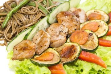with vegetables and spaghetti on a white background