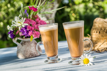 Coffee latte in a sunny garden