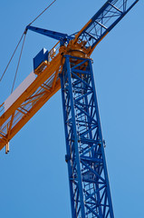 Fototapeta na wymiar New blue elevating crane with suspension.