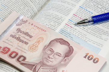 Thai banknote and dictionary