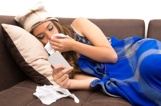 Beautiful young sick girl with a cold