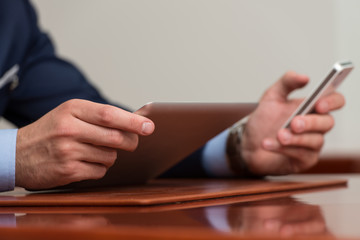 Close-Up Of Businessmen Using Touchpad