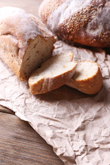 Fresh bread on wooden background