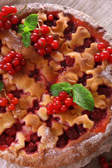 Tasty cake with berries on table close-up