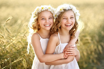 Portrait of two little girls twins - obrazy, fototapety, plakaty