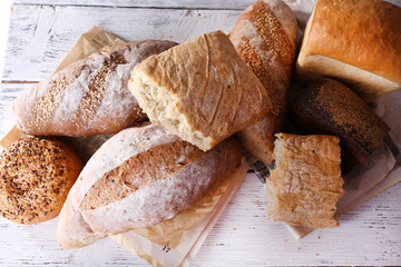 Fresh baked bread, on wooden background