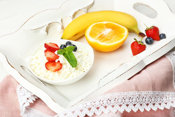 Delicious breakfast with cottage cheese and fruits
