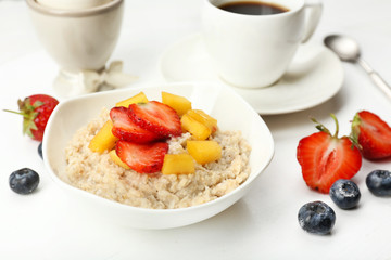 Delicious breakfast with coffee, egg and oatmeal