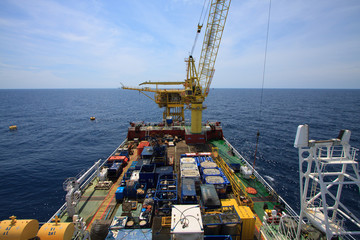 Large crane vessel installing the platform in offshore