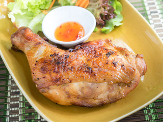 Grilled chicken thigh with vegetables.