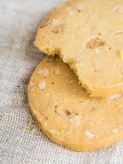 Bited cookies on linen napkin.