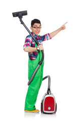 Funny man in green coveralls vacuum cleaning