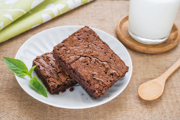 Brownies on plate and milk glass
