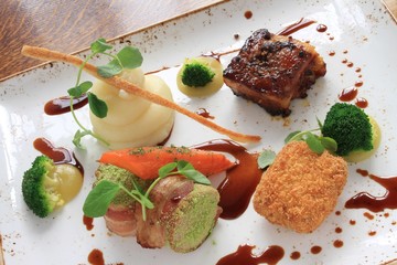 plated pork dinner with vegetables