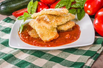 Zucchini Parmesan dinner with basil and squash