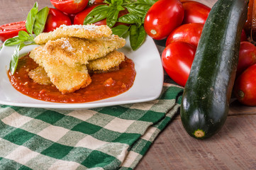 Zucchini Paramesan dinner with basil and squash