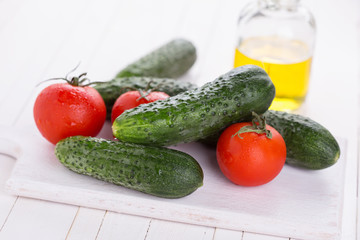 Fresh cucumbers on wooden background