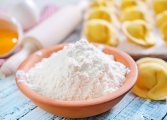 flour and raw pelmeni