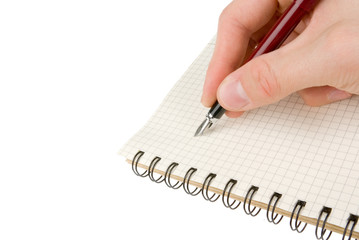 Hand writing on empty notepad (notebook) isolated on white