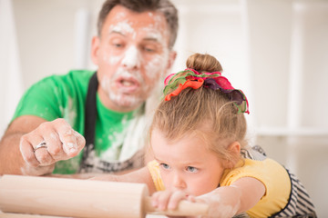 Father and daughter cooking