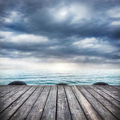 Wooden pier at overcast sky