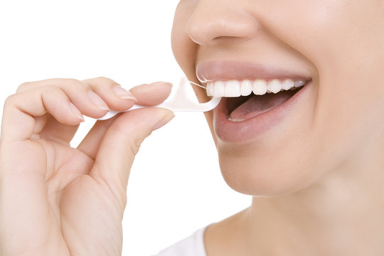 Woman and teeth floss (Toothpick)