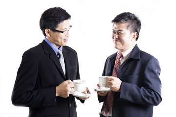Two Businessmans talkimg and drink the coffee