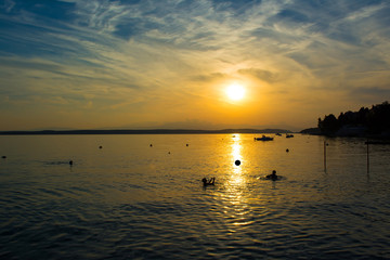 Children playing with ball in  the water