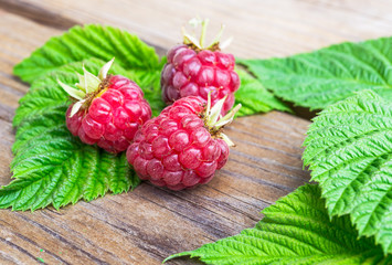Ripe raspberry on wood table