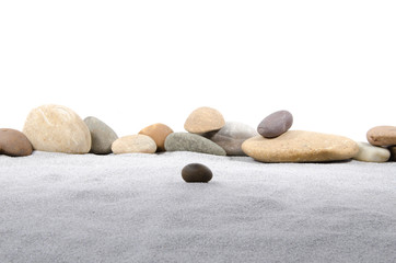 Pebble stones on gray sand