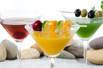 Cherry cocktail in a environment of sand and pebble stones