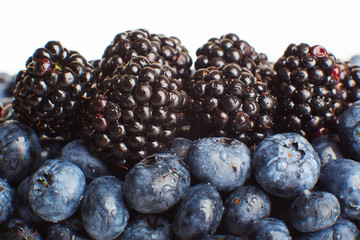 Freshly picked blueberries and blackberries close-up